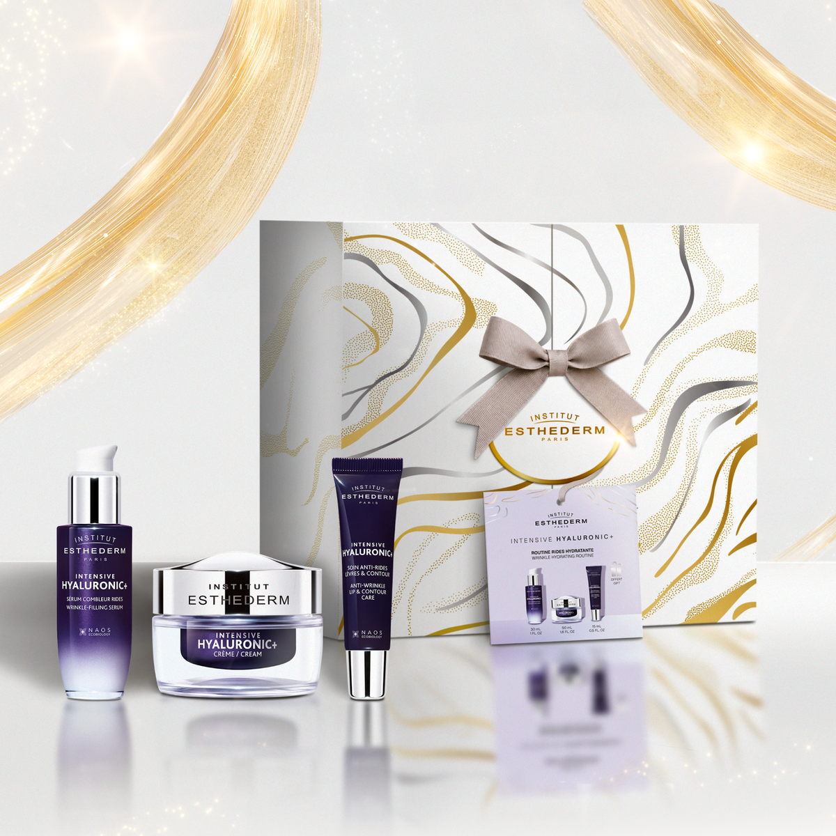Coffret soin visage Intensive Hyaluronic d'Institut Esthederm comprenant le sérum combleur, la crème hydratante et le soin anti-rides contour des lèvres offert.